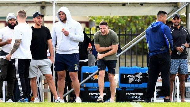 Tiger talk: Mitchell Moses shares a laugh with teammates on Monday. Photo: AAP
