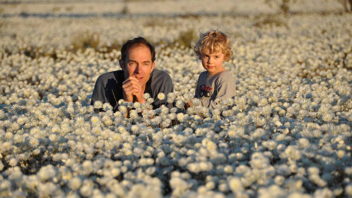 PURPOSE: Chris Darwin with his son Ras Darwin, sharing the beauty of the natural world. Picture: Annette Ruzicka (Bush Heritage Australia)