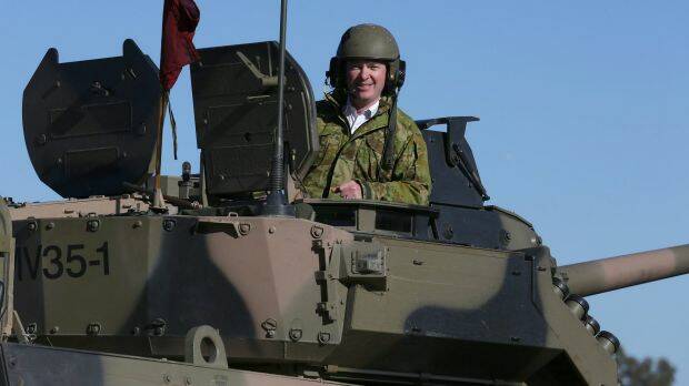 Defence Industry Minister Christopher Pyne, in the turret of an armoured vehicle at Victoria's Puckapunyal army base recently. Photo: Corporal Max Bree
