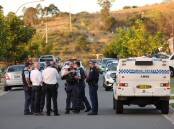 Police at Boolaroo on Monday evening. Picture by Peter Lorimer
