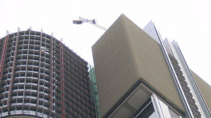 The crane dangling from Barangaroo's Tower One. Photo: Nick Ryan
