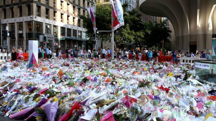 Some of the thousands of floral tributes left at Martin Place after the siege. Photo: James Alcock