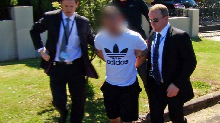 Police arrest Kevin Ly on Monday over the alleged murders of drug cook Son Thanh Nguyen and girlfriend Thi Kim Lien Do. Photo: NSW Police