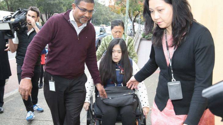  Yinuo "Ginger" Jiang, who broke both her legs when she jumped her burning unit in Bankstown, at the Glebe Coroner's Court on Monday. Photo: Peter Rae