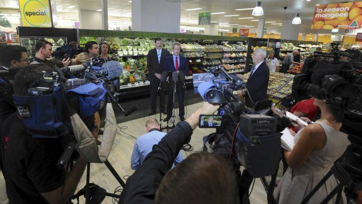 A media posse surrounds Bill Shorten in a Queanbeyan Woolworths store. Photo: Graham Tidy