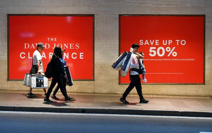 Shoppers are seen outside the David Jones department store for the Boxing Day sales in Sydney, Tuesday, December 26, 2017. National Retail Association chief executive Dominique Lamb saying shoppers were expected to spend $2.36 billion on Boxing Day, up three per cent on the 2016 figure of $2.28 billion. (AAP Image/Mick Tsikas) NO ARCHIVING