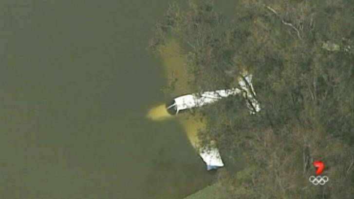 The plane managed to avoid trees and land in the water at Liverpool Golf Club. Photo: Seven News