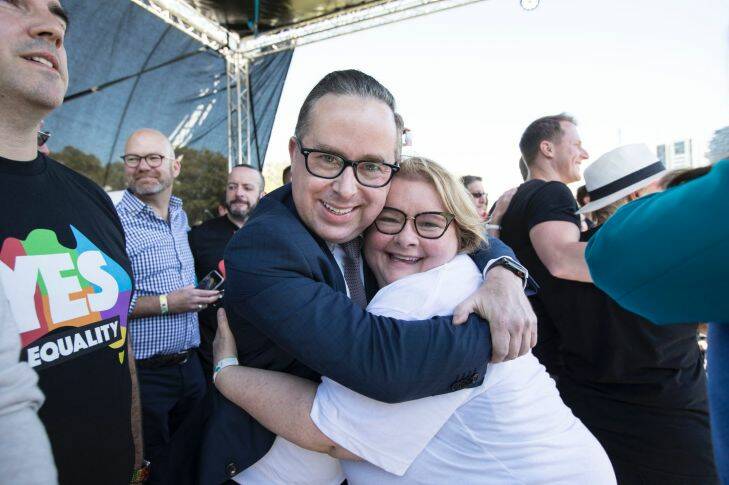 SEXPOL :  Allan Joyce CEO of Qantas hugs Mada Szubanski on the stage to celebatre the YES vote at Prince Alfred Park, Sydney the verdic of the postal vote on same sex marriage is YES in every state, on 15 November 2017. Photo: Jessica Hromas