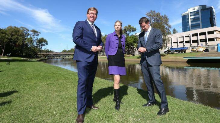 New home: Arts Minister Troy Grant, MAAS director Dolla Merrillees and NSW Premier Mike Baird opposite the proposed site in Parramatta for the Powerhouse Museum. Photo: Louise Kennerley