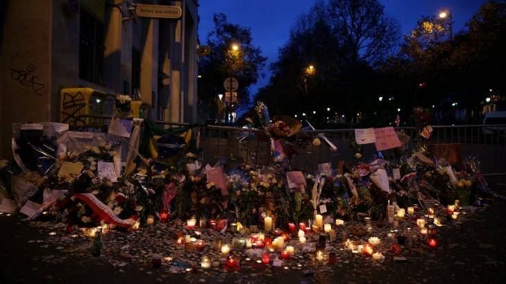 A memorial honouring those killed by terrorists including the 89 killed in the Bataclan attack grows in Paris. Photo: Andrew Meares