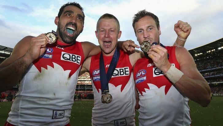 Grand champs ... Ryan O'Keefe, centre, celebrates with Adam Goodes and Jude Bolton after winning the 2012 grand final