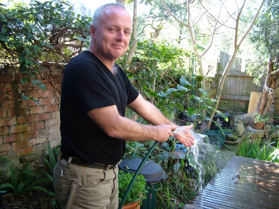 Simple changes: Michael Mobbs uses treated recycled sewage to water his garden.