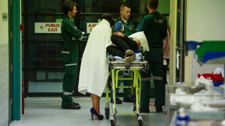 An intoxicated man with his partner arrive at the emergency department at Calvary Hospital after he collapsed at Moose Heads night club.
 Photo: Jay Cronan