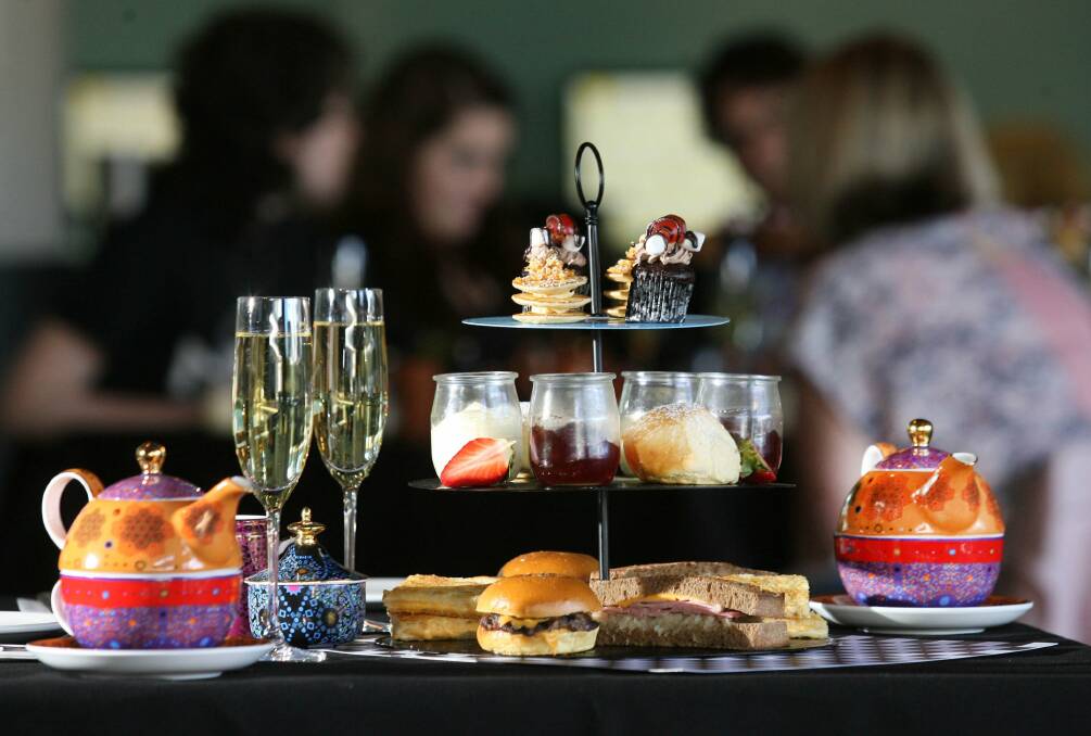Social outing: The Atura Hotel has made ‘‘high tea’’ quirky by serving it on a three-tiered stack of vinyl records and serving ‘‘sliders’’ instead of cold sandwiches. Pictures: Helen Nezdropa