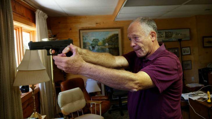 Richard Feldman with a Glock .45 calibre pistol, one of over 100 guns he owns. Photo: Trevor Collens