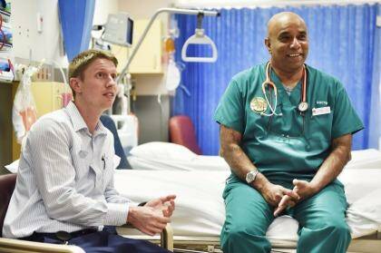 "The emergency department can't admit patients if there's no flow at the other end. Now everyone is involved": Dr Sellappa Prahalath, with nurse unit manager Daryn Mitford. Photo: Nick Moir