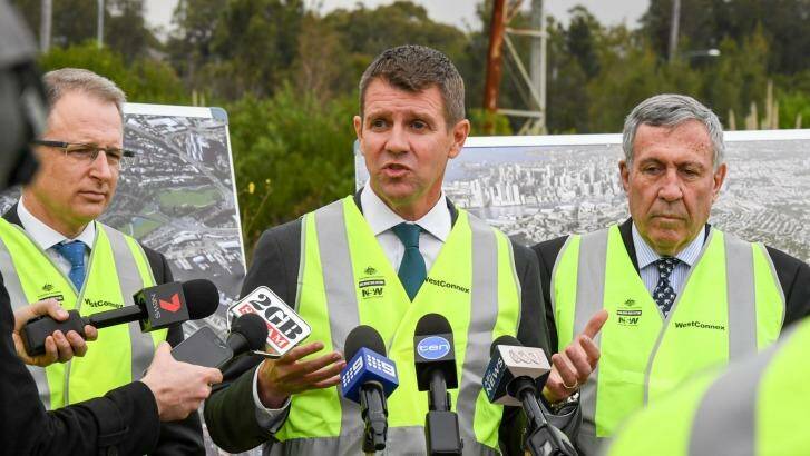 NSW Premier Mike Baird, centre, Roads Minister Duncan Gay, right, and Federal Minister for Urban Infrastructure Paul Fletcher at the Rozelle Rail Yards.  Photo: Peter Rae