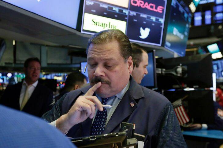 Trader John Santiago works on the floor of the New York Stock Exchange, Tuesday, Jan. 9, 2018. Stocks are opening higher on Wall Street, led by gains in health care and financial companies. (AP Photo/Richard Drew)