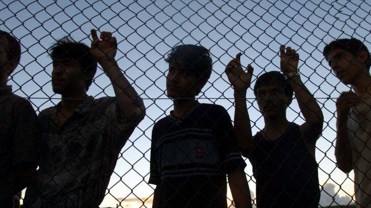 Men, women and children languish behind wire, facing an uncertain future. Photo: Angela Wylie