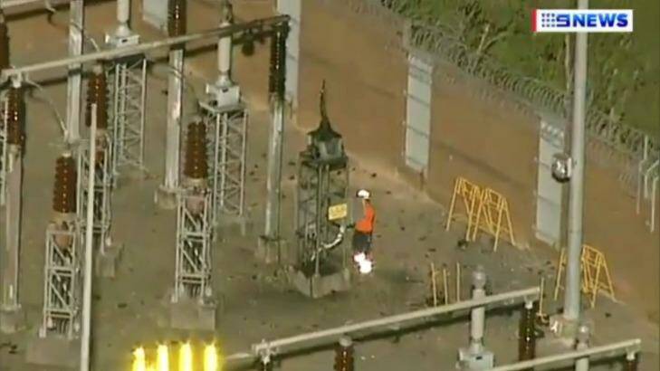 A worker inspects equipment at Meadowbank substation, where residents heard a loud bang. Photo: Nine News