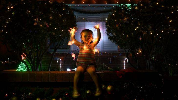 2-year-old Robin Rose Sinclair visits the homes on Second Street Ashbury for the first time. Photo: Steven Siewert