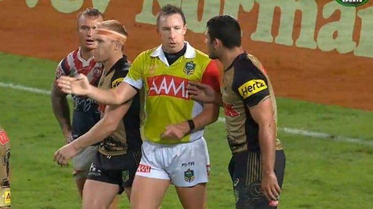 Hands on: Sam McKendry touches referee Jared Maxwell during the Panthers' win against the Sydney Roosters on Monday night. Photo: Fox Sports