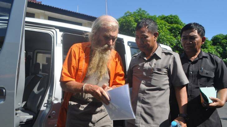 Robert Andrew Fiddes Ellis arrives at a Bali police station. Photo: Supplied