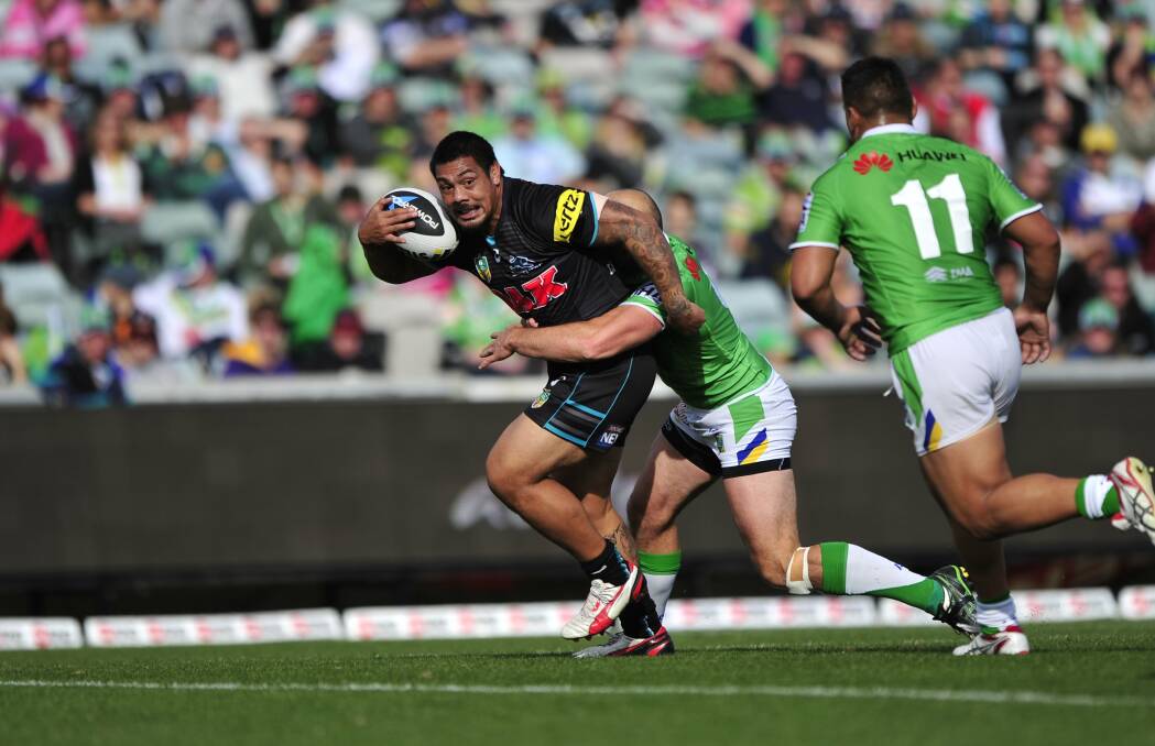 SPORT: Canberra Raiders v Penrith Panthers at Canberra Stadium, Bruce.  Penrith player Sika Manu is tackled by Raiders player Terry Campese.   18th May 2014. Photo by Melissa Adams of The Canberra Times.