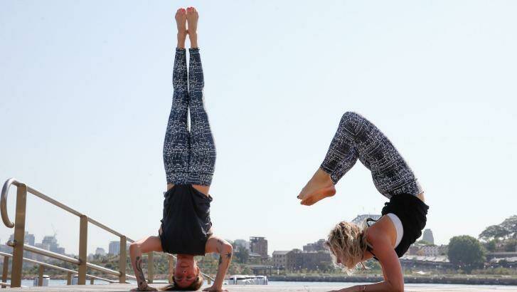 Bodypass yoga teachers, (L) Georgia van Tiel and Carla McMillan demonstrate some positions. Photo: Peter Rae