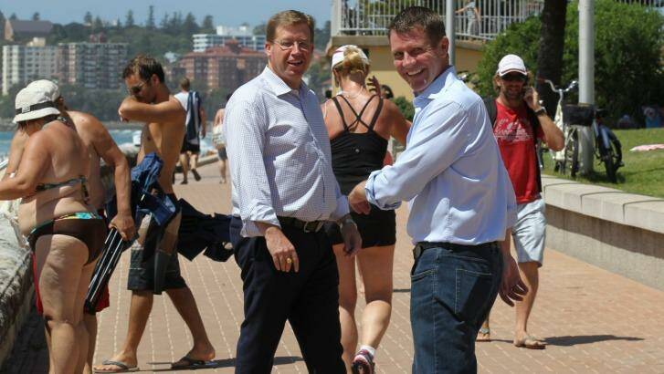 Premier Mike Baird, right, and Deputy Premier, Troy Grant, at Queenscliff beach on Sunday. Photo: Peter Rae