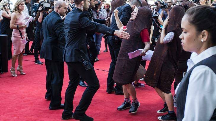 A person dressed as a sausage attempts to disrupt the AACTA Awards in Sydney on Wednesday. Photo: Dominic Lorrimer