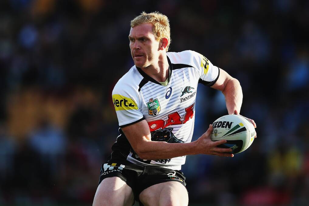AUCKLAND, NEW ZEALAND - JUNE 29: Peter Wallace of the Panthers looks to pass the ball during the round 16 NRL match between the New Zealand Warriors and the Penrith Panthers at Mt Smart Stadium on June 29, 2014 in Auckland, New Zealand.  (Photo by Hannah Peters/Getty Images) Peter Wallace
