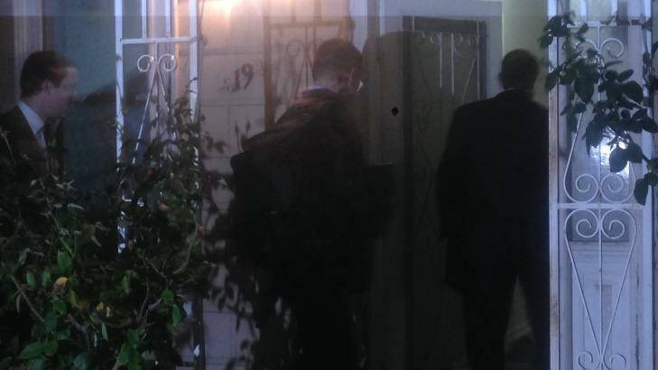 AFP agents raid a Labor staffer's house in Melbourne. Photo: Nick Toscano