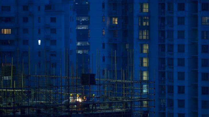 Labourers at a residential construction site in Shanghai this July as fears of a Chinese property bubble grew. 