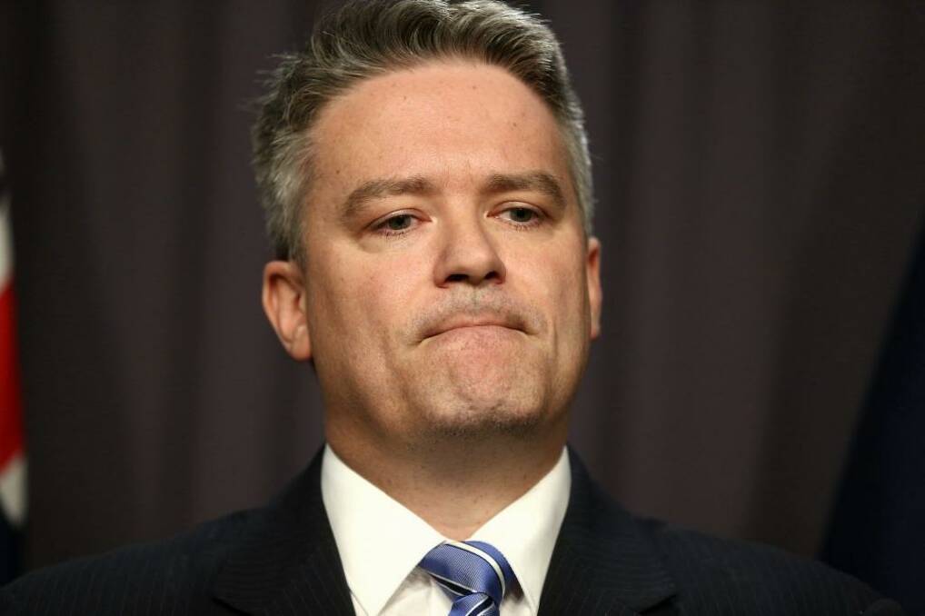 Federal finance minister Mathias Cormann: "It is completely false to suggest that such indemnity insurance universally excludes cover for business written through foreign insurers." Photo: Alex Ellinghausen