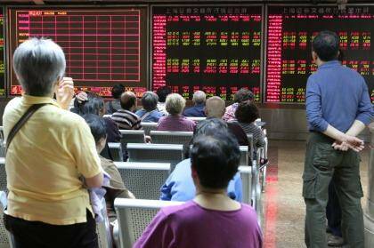 Investors at the China Securities office in Beijing watch closely as the sharemarket opens. Photo: 5iphoto