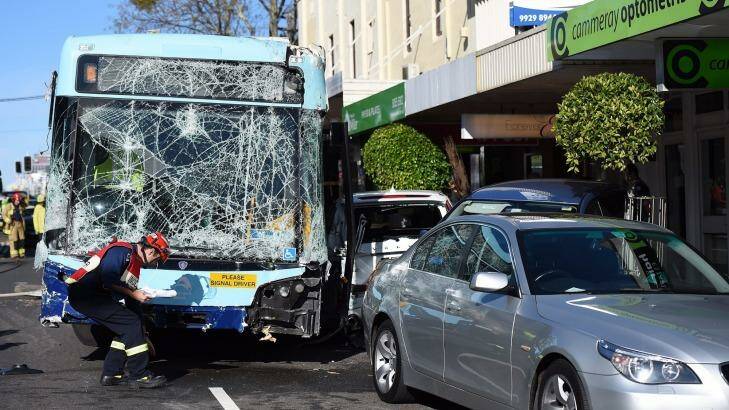 A bus has crashed into a pedestrian and row of cars in Cammeray. Photo: Kate Geraghty