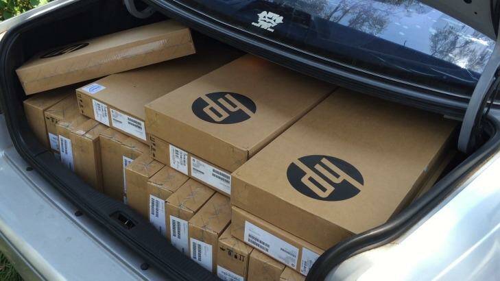 A car boot full of new laptops ready for delivery for new vocational students. Photo: Michael Bachelard