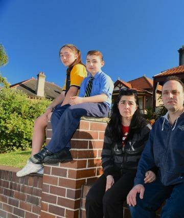 "You're in limbo": Joe Cavallaro with his wife, Vera, and children Alfio and Marchella, outside the Haberfield home they recently sold to the government.  Photo: Steven Siewert