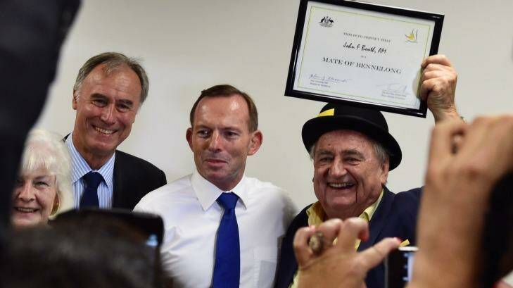 John Alexander, the member for Bennelong, pictured with former PM Tony Abbott and local newspaper proprietor John Booth, who was awarded a ''matehood''.  Photo: Nick Moir