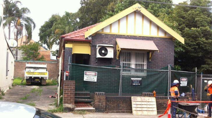 A temporary fence has been erected around Mr Ngo's former home in St Peters. Photo: WestConnex Action Group