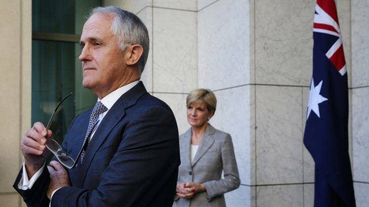 Prime Minister Malcolm Turnbull, flanked by deputy Liberal leader Julie Bishop, announces Joe Hockey will resign from Parliament. Photo: Andrew Meares