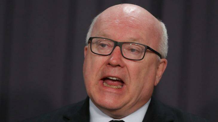 Attorney-General Senator George Brandis addresses the media during a press conference at Parliament House on Tuesday. Photo: Alex Ellinghausen