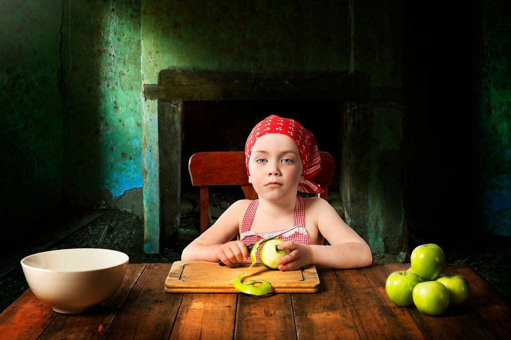 FINALIST: "The Apple Peeler" - portrait of Gemma Ferguson. "This is an image of my daughter who loves to cook." Photo: Brett Ferguson