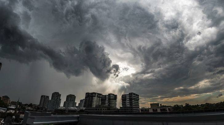 Storm clouds mass over Burwood on Monday. Photo: Christopher Getts
