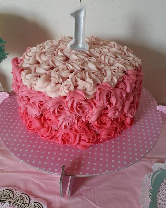 Pink frosting rose cake.