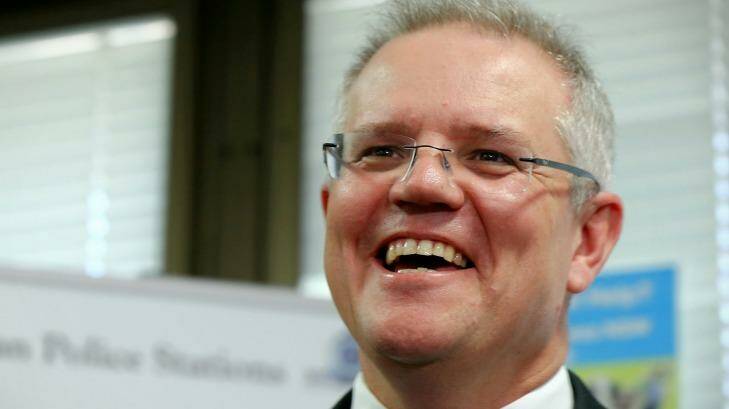 Federal Treasurer Scott Morrison has been warned he will put Australia's triple-A credit rating at risk if the budget pursues only limited spending cuts and doesn't do much to collect more tax. Photo: Alex Ellinghausen