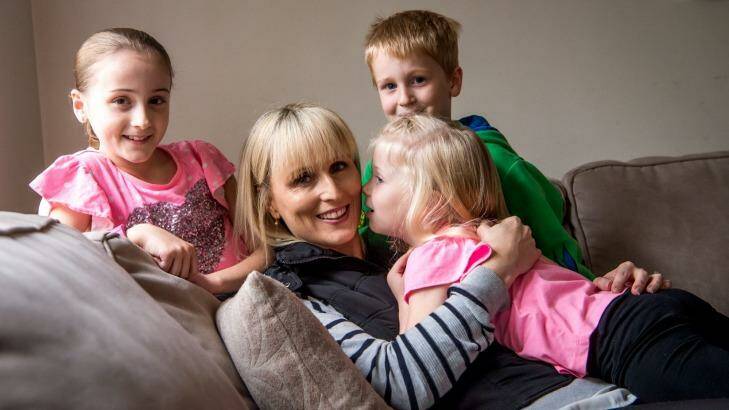 Kylie Gellie, who has had a mastectomy and oophorectomy to avoid breast and ovarian cancer, with her children Jasmine, Korby and Sienna. Photo: Justin McManus