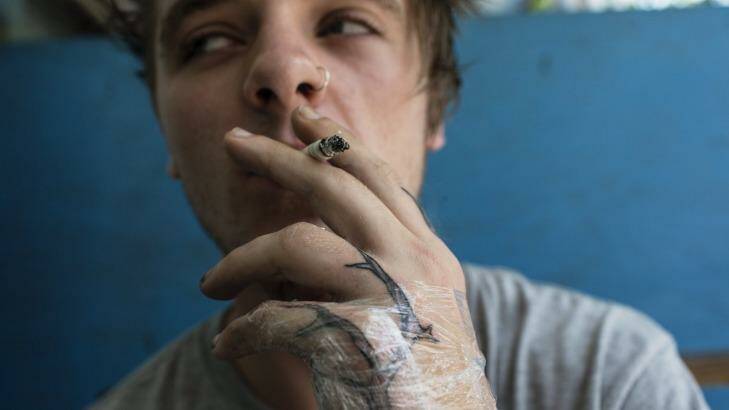 Bryn Parkinson with a tattoo of a tree that runs down his left arm.  Photo: Nic Walker