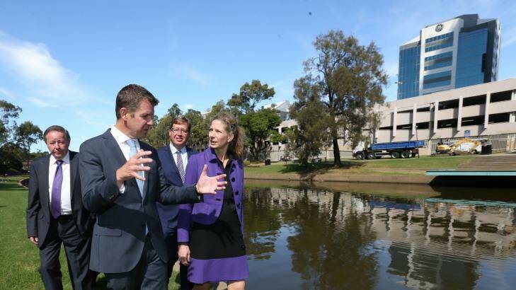 Former Parramatta mayor Paul Garrard (left), pictured with then NSW premier Mike Baird last year opposite the proposed site of the new Powerhouse Museum. Photo: Louise Kennerley